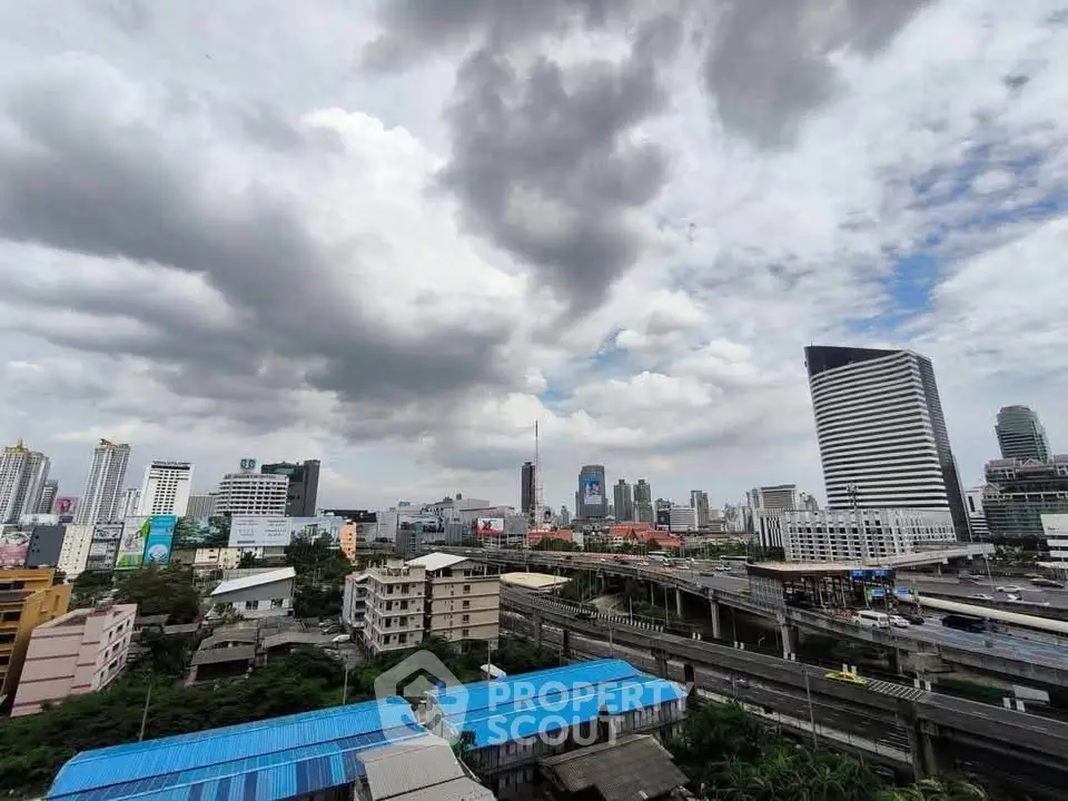 Stunning cityscape view with modern skyscrapers and dramatic clouds, showcasing urban living at its finest.