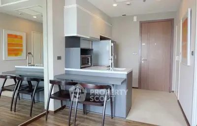 Modern kitchen with sleek design and breakfast bar seating