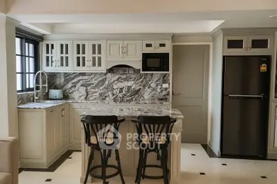 Elegant kitchen with marble countertops and modern appliances