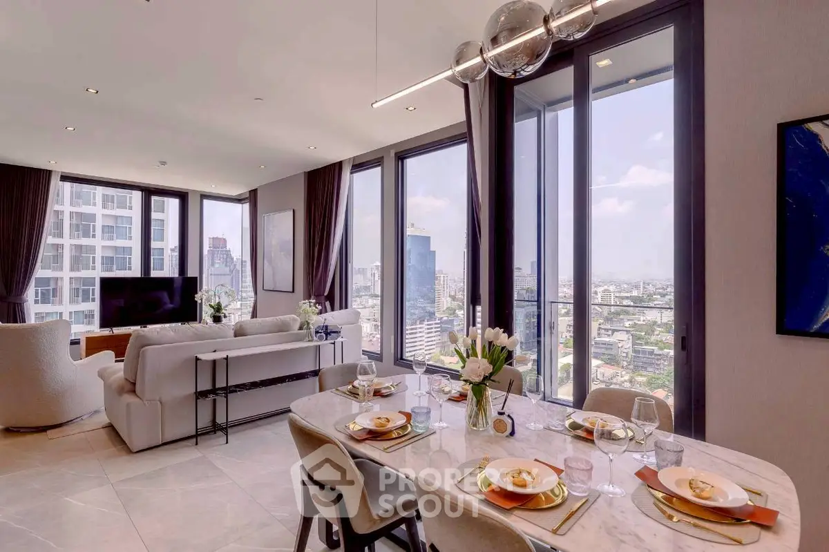 Luxurious open-plan living and dining area with stunning city views, modern decor, and elegant furnishings.