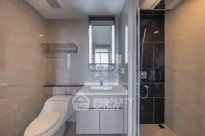 Modern bathroom with sleek design and glass shower enclosure