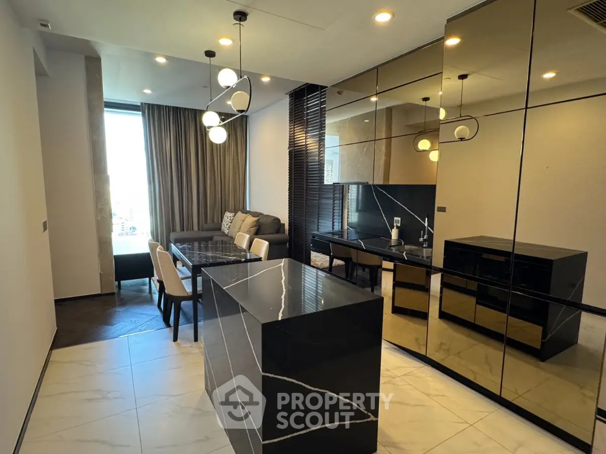 Luxurious modern living room with elegant black marble accents and stylish lighting