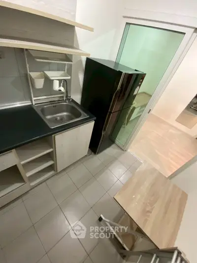 Compact kitchen with modern appliances and open layout design