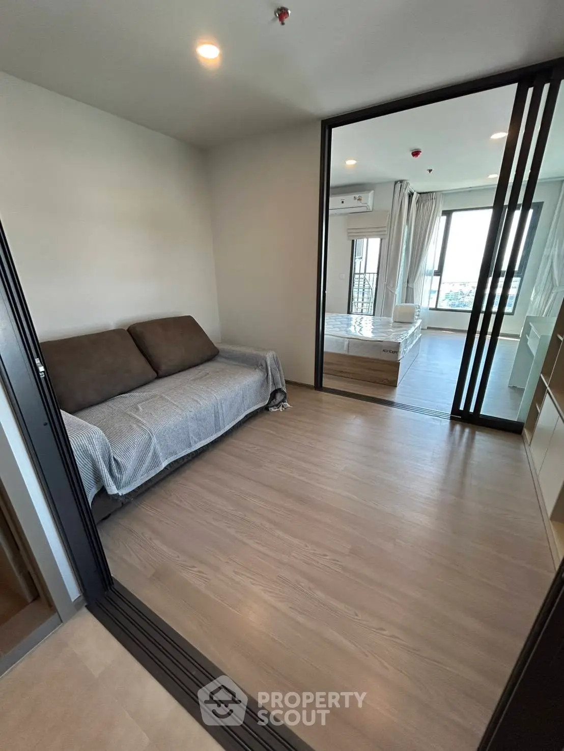 Modern apartment with sliding doors and cozy furnishings