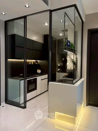 Modern kitchen with sleek glass partitions and built-in appliances