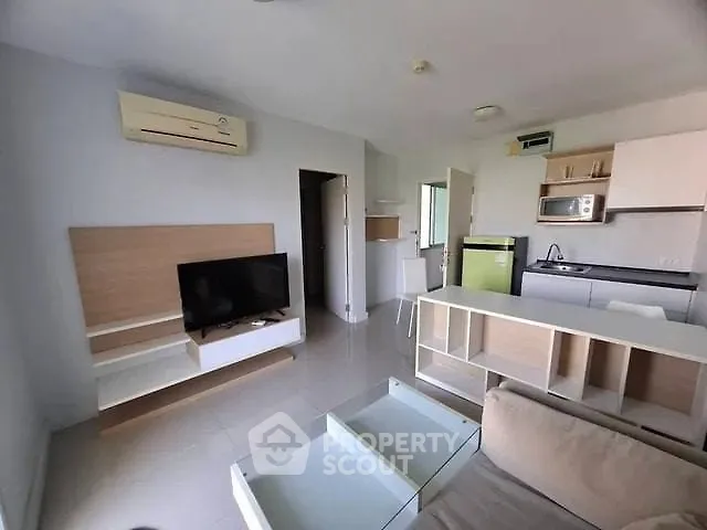 Modern living room with open kitchen and sleek furniture design