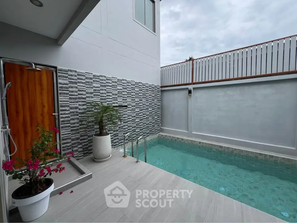 Modern private pool area with stylish design and wooden accents