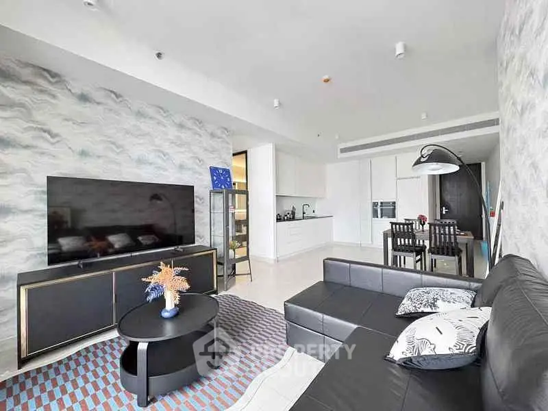 Modern living room with stylish decor and open kitchen layout