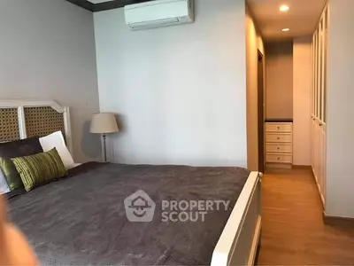 Spacious bedroom with modern decor and ample storage space