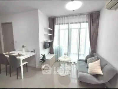 Modern living room with cozy seating and dining area, bright natural light