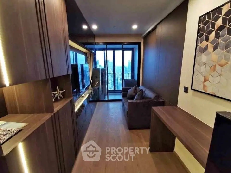 Modern living room with city view, sleek furniture, and stylish decor in a high-rise apartment.
