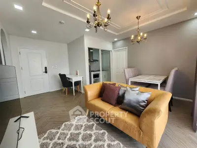 Elegant living room with modern chandelier and cozy seating area