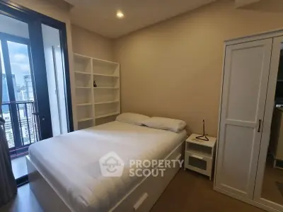 Modern bedroom with city view, featuring a cozy bed, built-in shelves, and a sleek wardrobe.