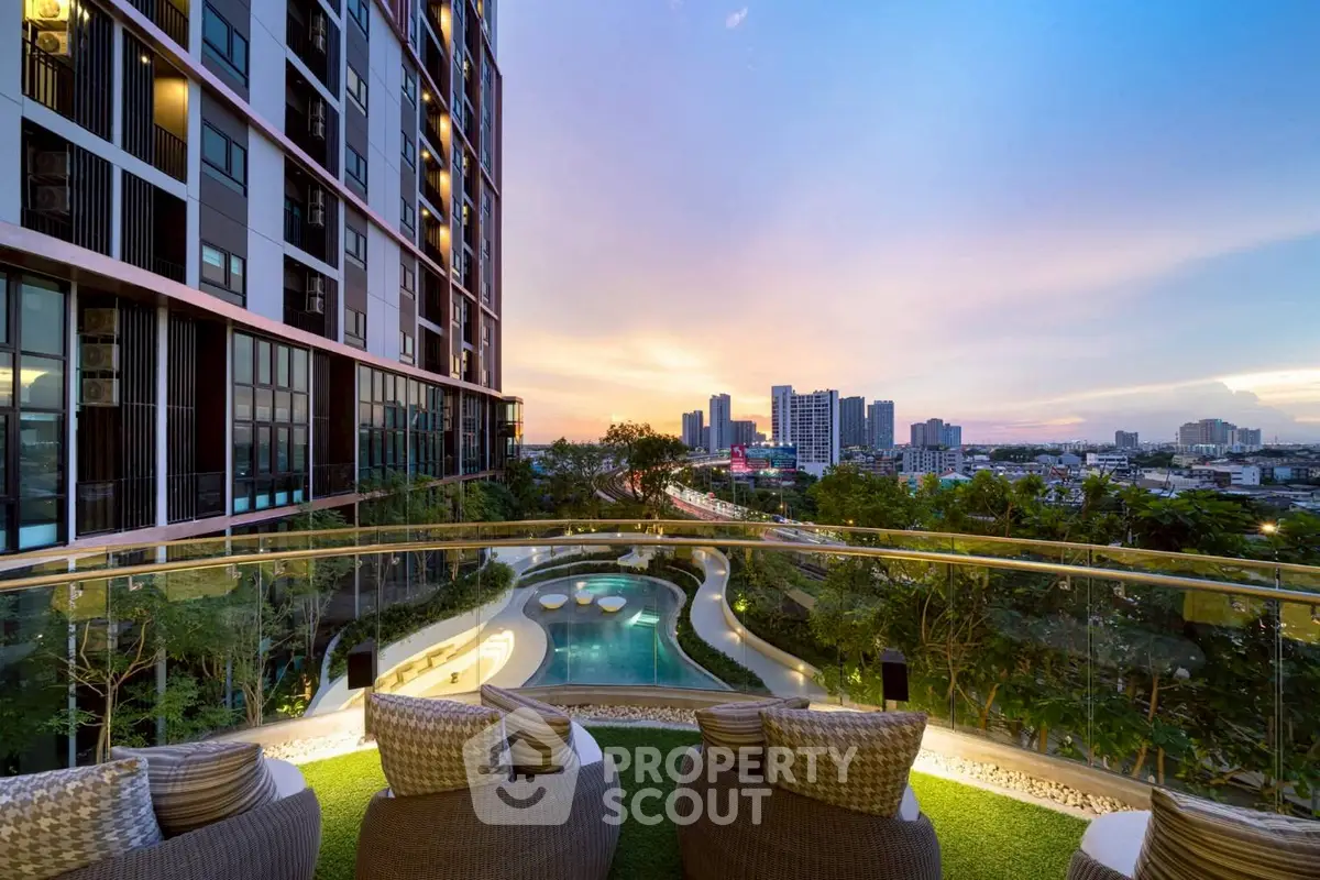 Luxurious high-rise apartment with stunning city view and poolside seating at sunset.