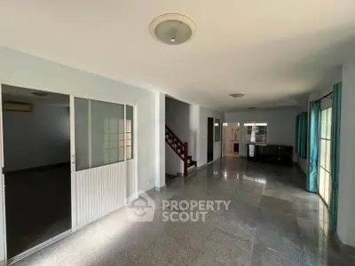 Spacious open-plan living area with natural light and modern finishes