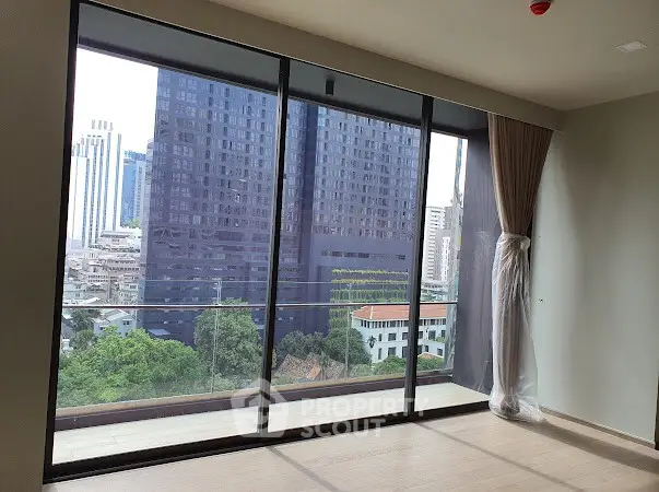 Spacious apartment with floor-to-ceiling windows and city view