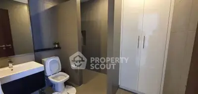 Modern bathroom with sleek fixtures and ample storage space