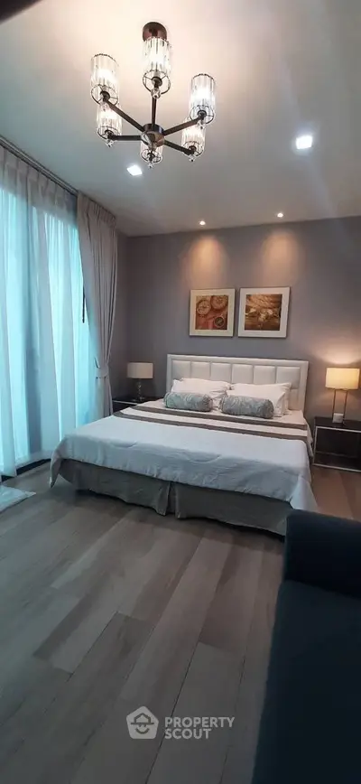 Luxurious bedroom with elegant decor and large windows in modern apartment