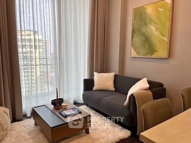 Stylish living room with modern decor and city view through large windows.