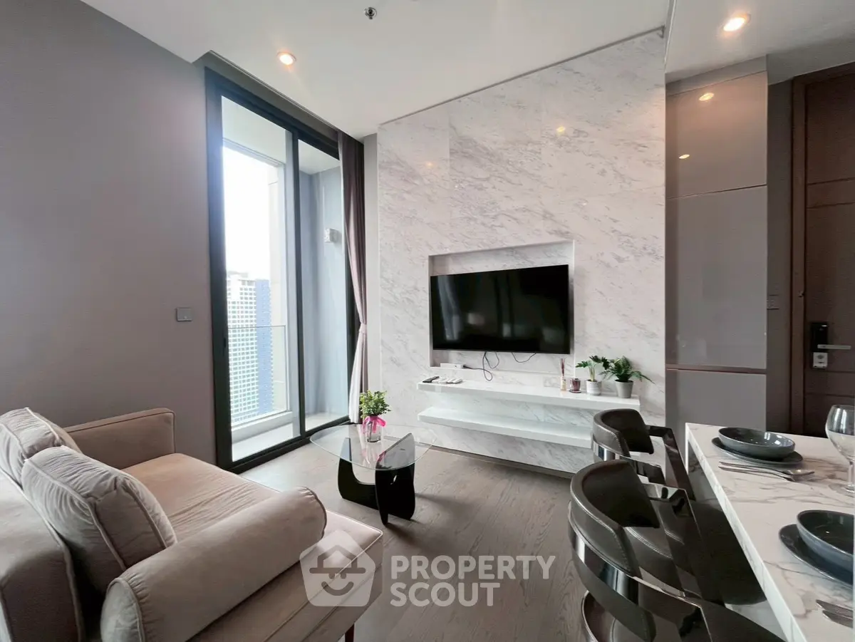 Luxurious modern living room with marble accents and city view balcony.
