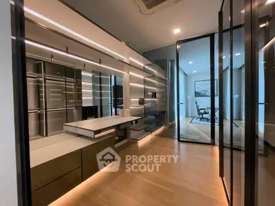 Luxurious modern interior with sleek design and glass partitions, showcasing a stylish and spacious living area.