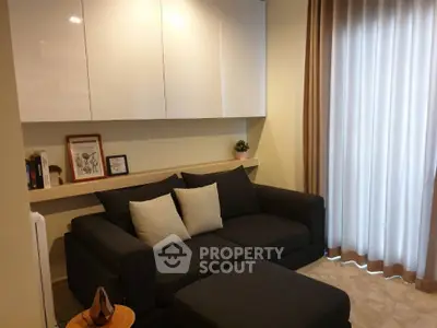 Cozy living room with modern black sofa and elegant decor