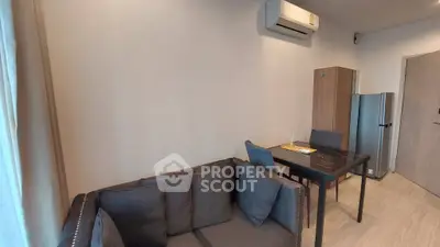 Modern living room with sleek furniture and air conditioning, perfect for comfortable urban living.