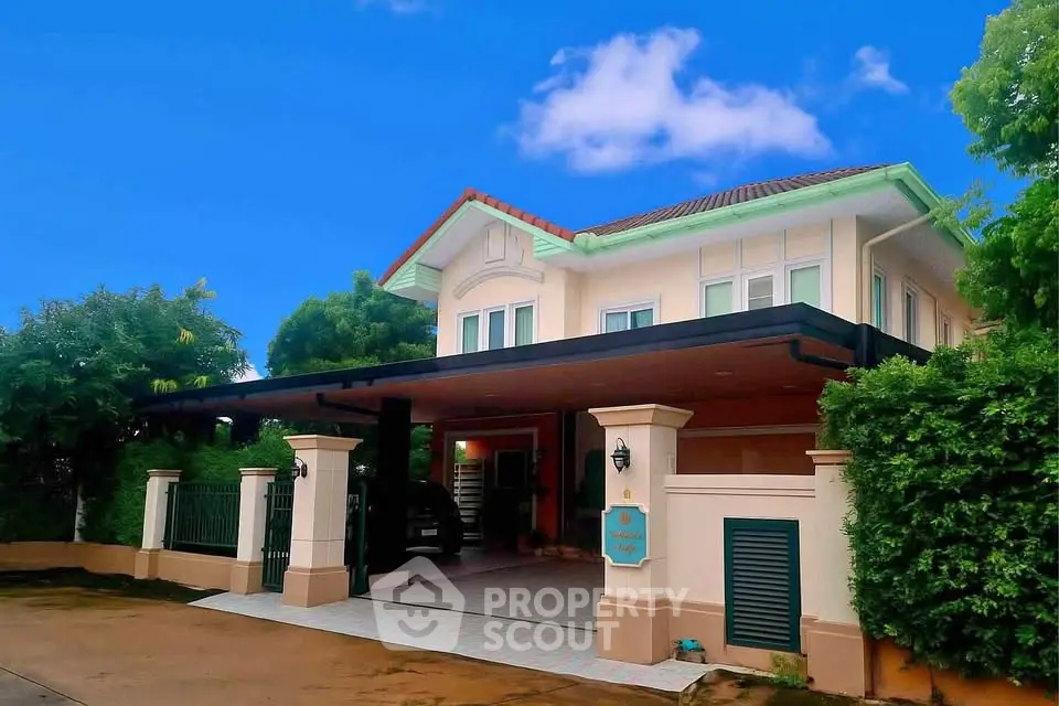 Charming two-story house with lush greenery and spacious driveway