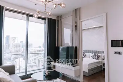 Modern living room with city view and adjacent bedroom in luxury apartment