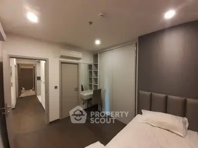 Modern bedroom with sleek design and built-in study area