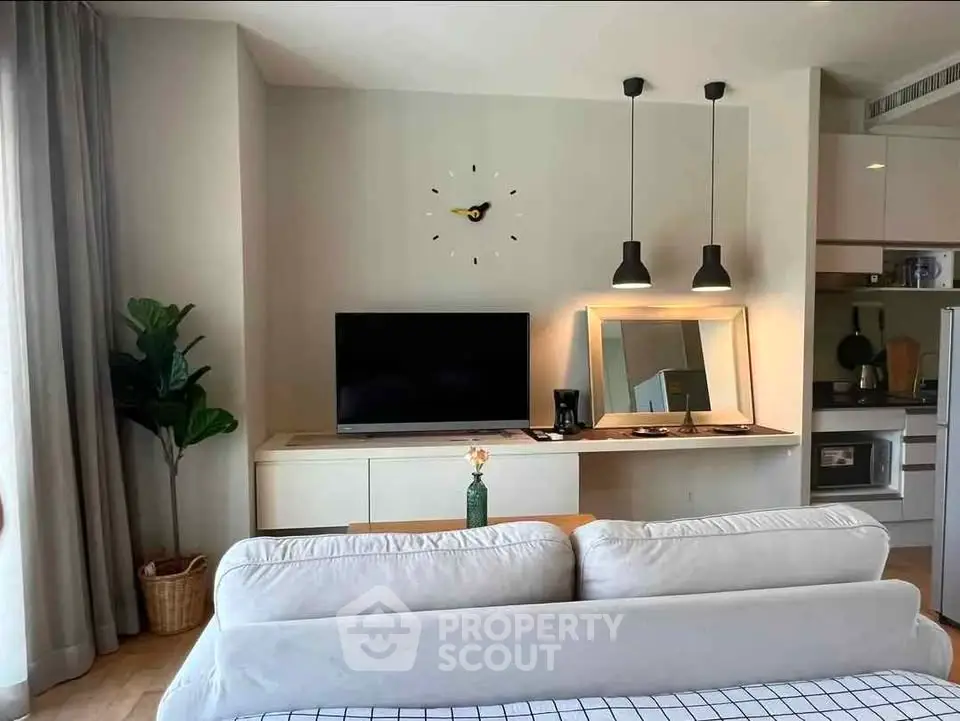 Modern living room with stylish decor and open kitchen layout