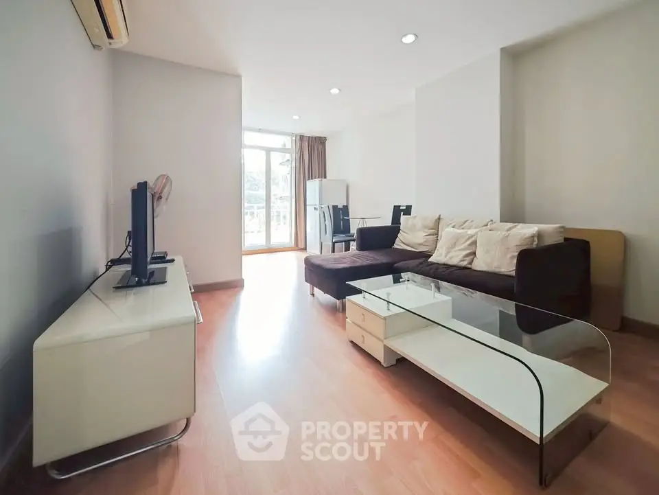 Spacious living room with modern furniture and natural light