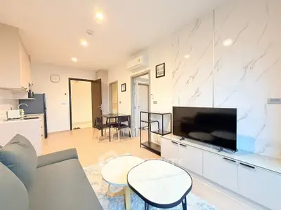 Modern living room with stylish decor and open layout in a contemporary apartment.