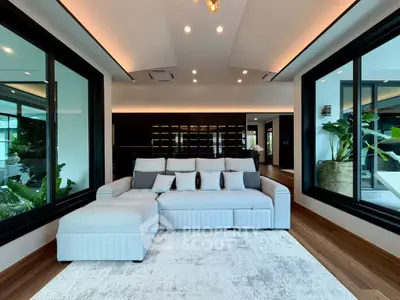 Luxurious modern living room with large windows and stylish decor
