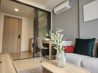 Modern living room with stylish decor and compact dining area