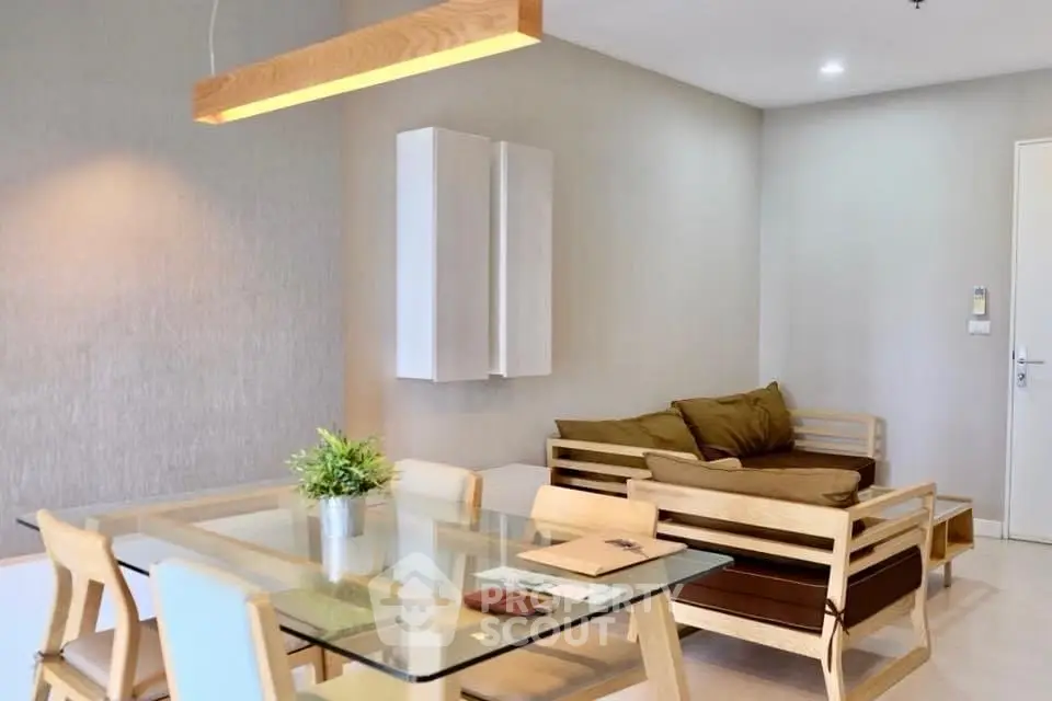 Modern living room with stylish wooden furniture and elegant lighting, perfect for contemporary living.