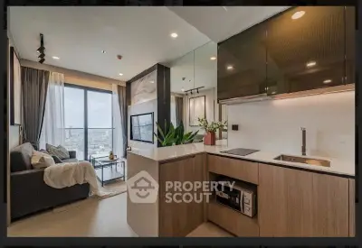 Modern open-layout living room and kitchen with city view, stylish decor, and natural light.