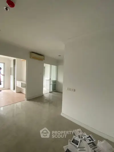 Spacious modern apartment interior with sleek design and ample natural light