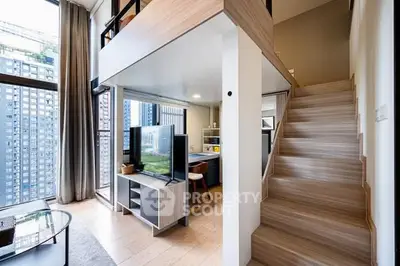 Modern loft apartment with mezzanine and large windows offering city views.