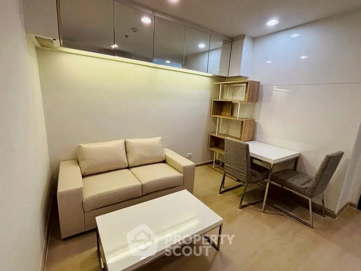 Modern living room with cozy sofa and dining area in stylish apartment