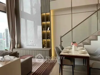 Luxurious modern living room with high ceilings and elegant dining area in a stylish apartment.