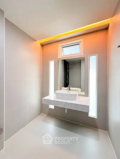 Modern minimalist bathroom with sleek design and ambient lighting
