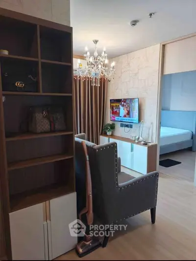 Modern living room with elegant chandelier and stylish decor