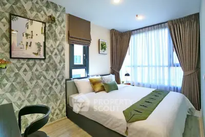 Stylish modern bedroom with geometric accent wall and large window
