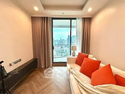 Modern living room with city view and cozy seating area.