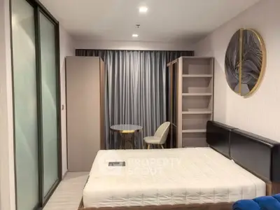 Modern bedroom with stylish decor and ample storage space in a contemporary apartment.