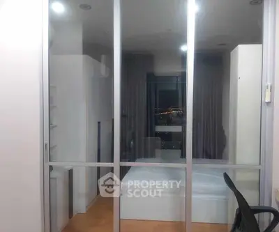 Modern bedroom with glass partition and city view