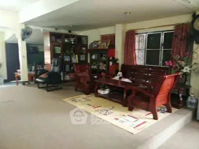 Spacious living room with elegant wooden furniture and cozy decor