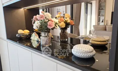 Elegant interior with decorative flowers and modern furnishings in a stylish living space.