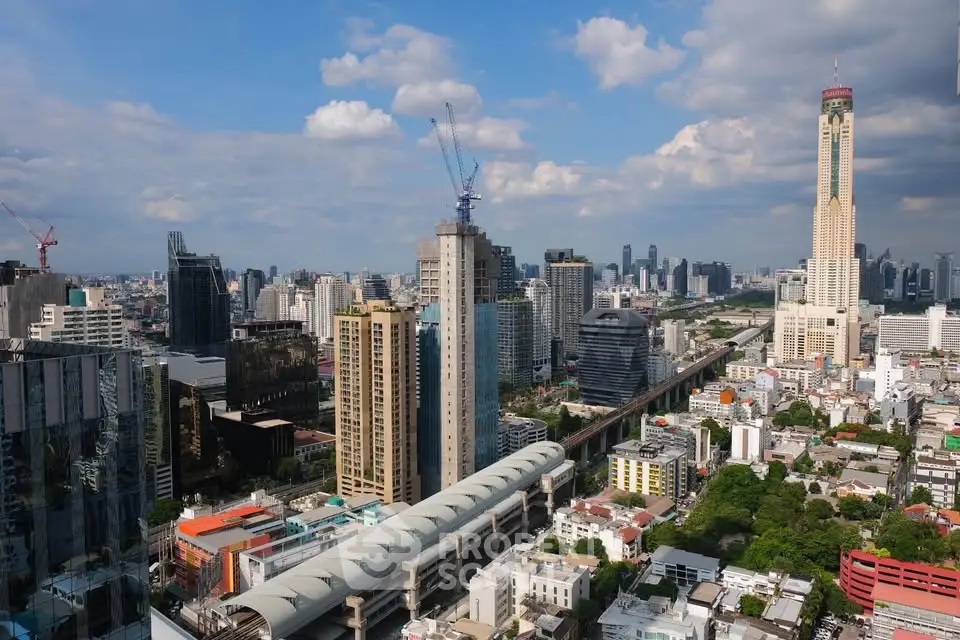Stunning cityscape view of modern skyscrapers and urban skyline under a vibrant blue sky.